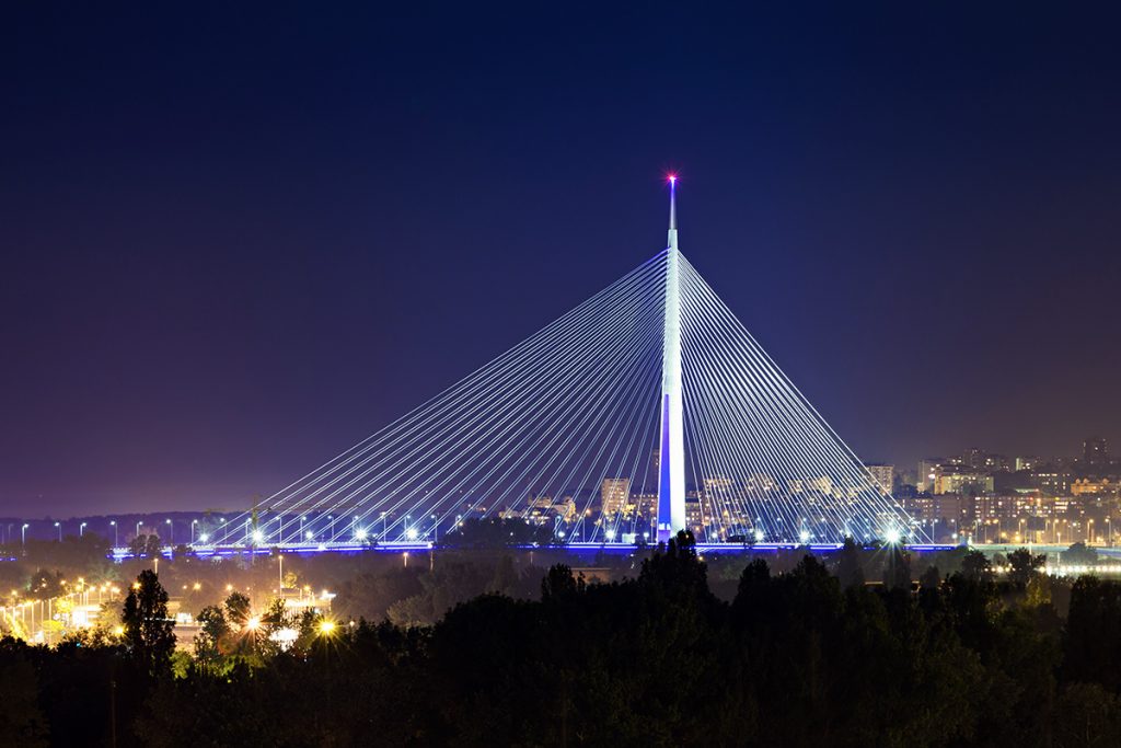 Ada Bridge illuminated at night in Belgrade